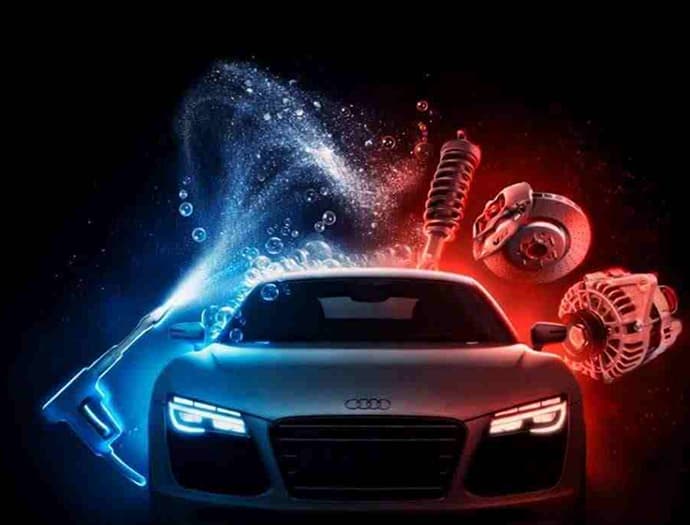 Silver sports car lit in blue and red with detailing spray and floating mechanical parts